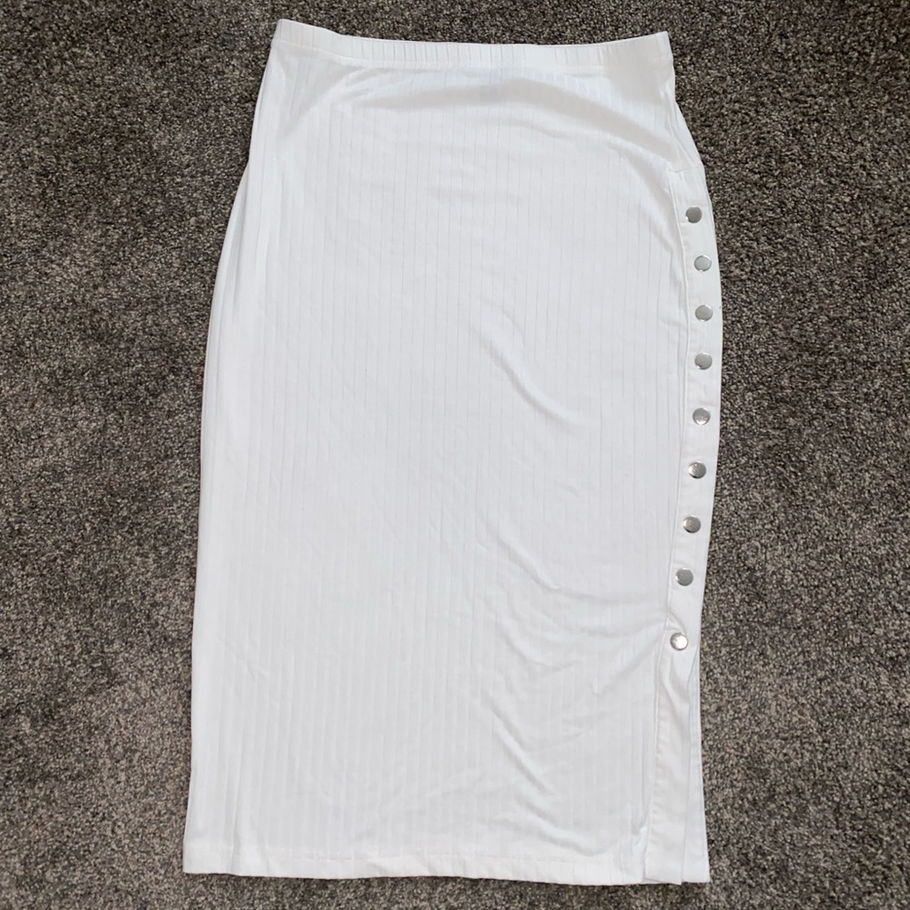 Stretchy white mid length skirt with side buttons. Never worn new without tags.